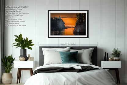 a bedroom with a bed and a picture on the wall