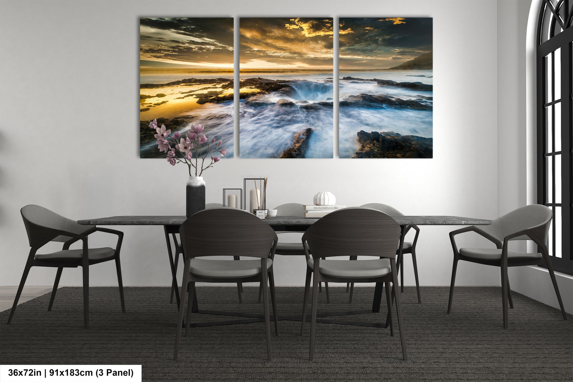 a dining room table with chairs and a painting on the wall