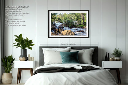 a bedroom with a bed and a picture on the wall