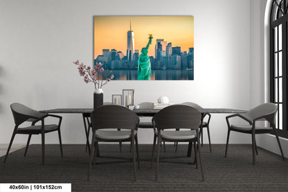 a dining room table with chairs and a painting of the statue of liberty