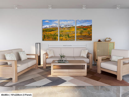 a living room filled with furniture and a painting on the wall