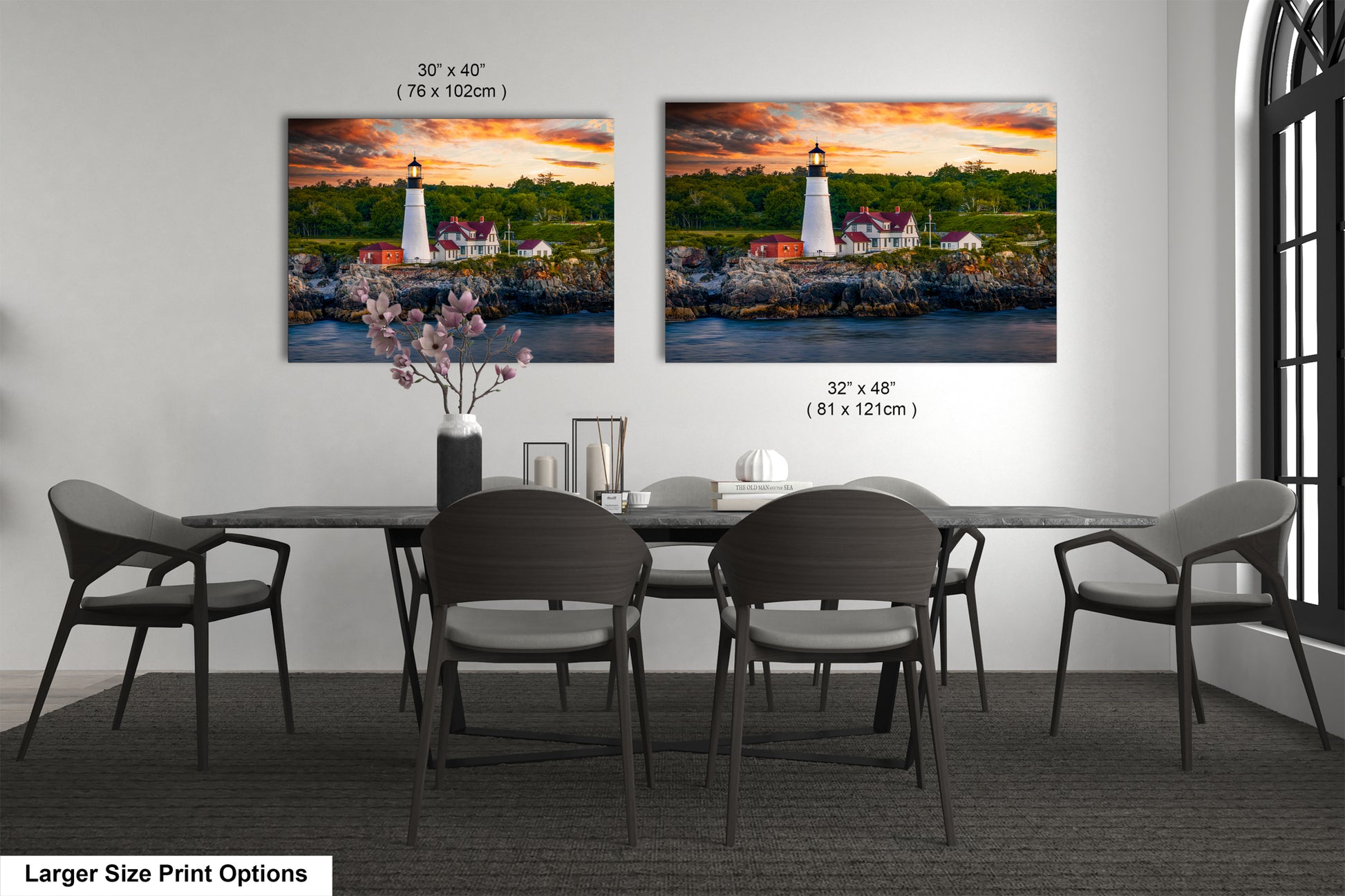 a dining room table with four chairs and a painting of a lighthouse