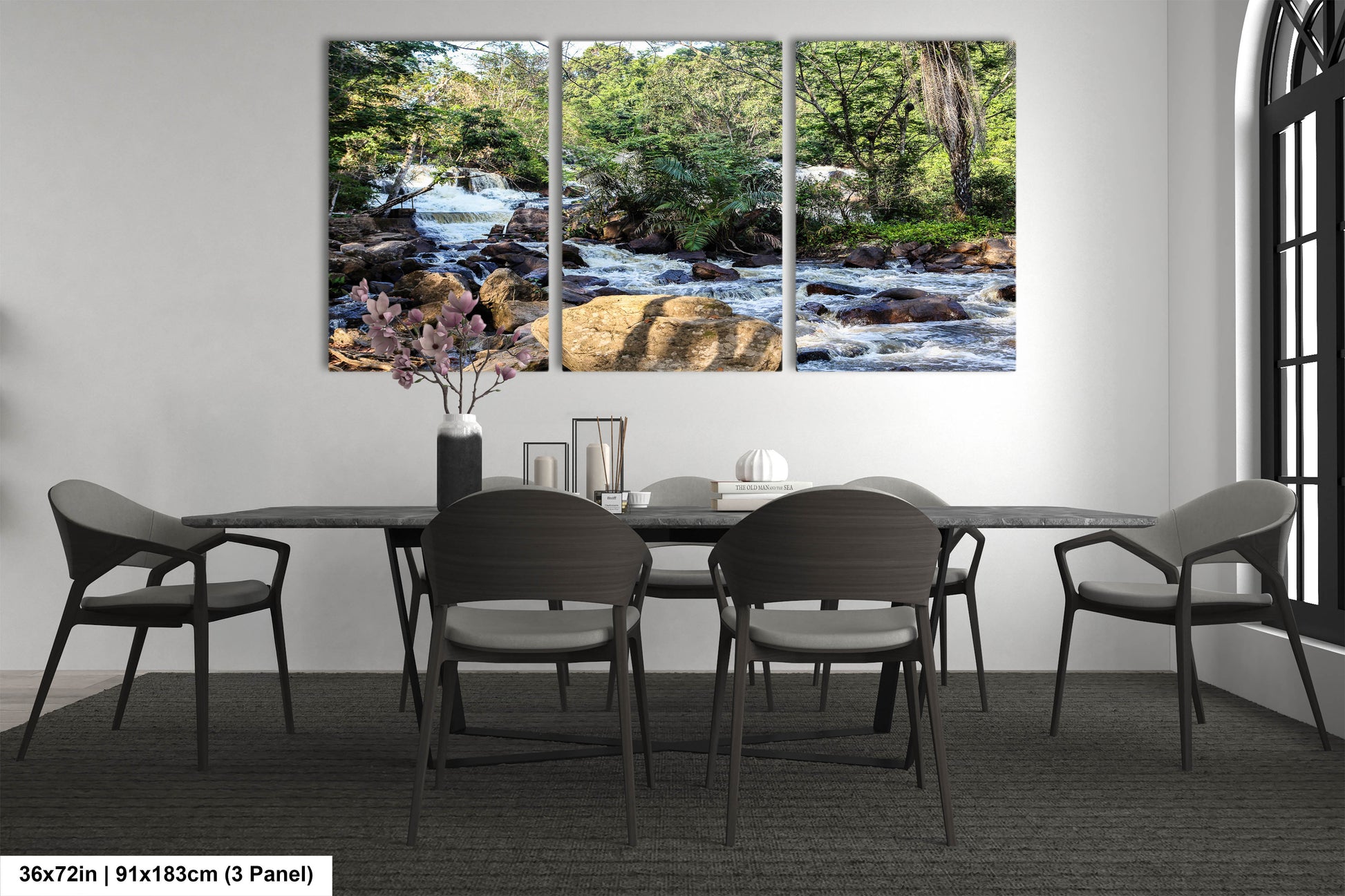 a dining room table with chairs and a painting on the wall