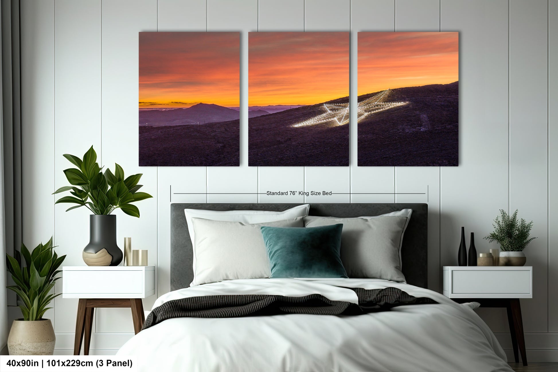 a bed room with a neatly made bed and two paintings on the wall
