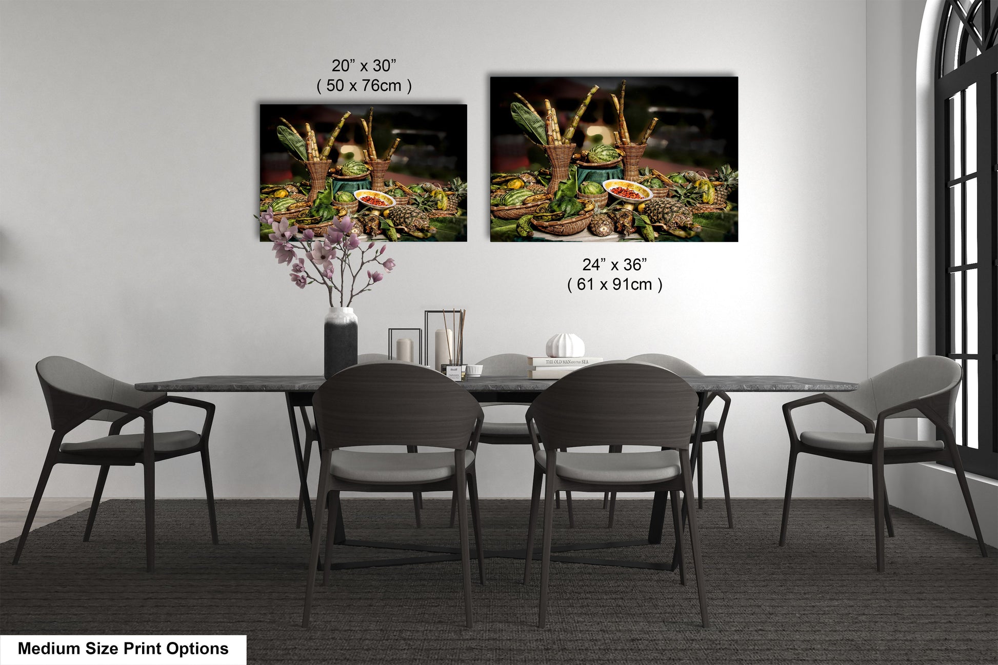 a dining room table with four chairs and a vase of flowers