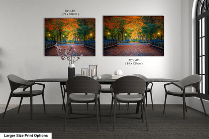 a dining room table with four chairs and a painting on the wall