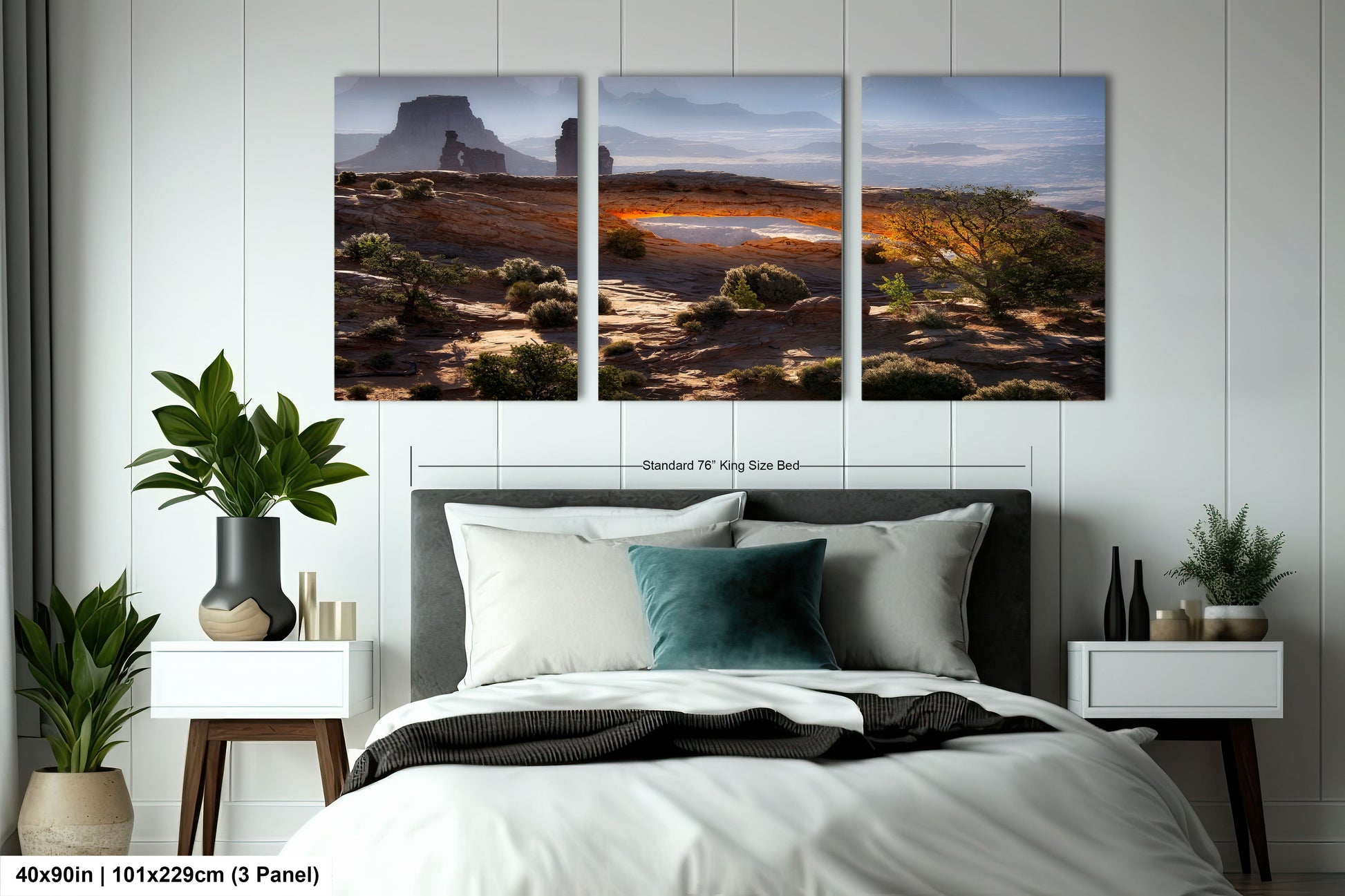 a bedroom with a bed and two paintings on the wall