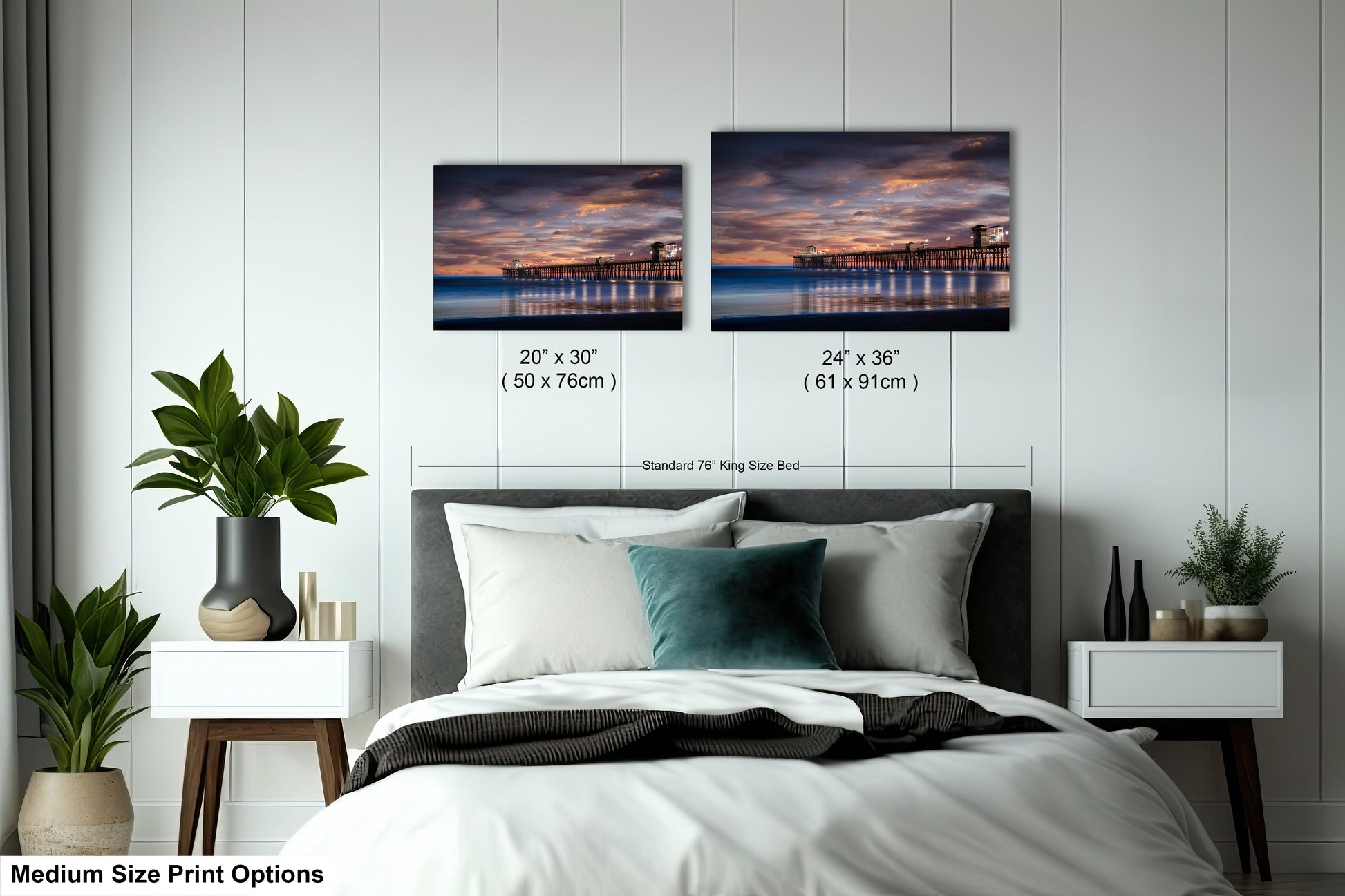 a bedroom with a bed and two pictures on the wall