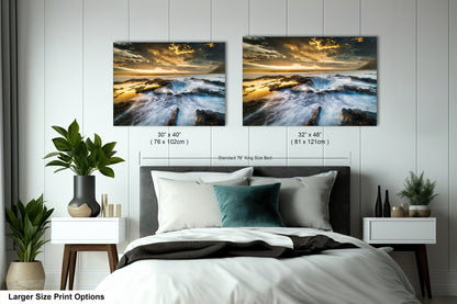 a bedroom with a bed and two pictures on the wall