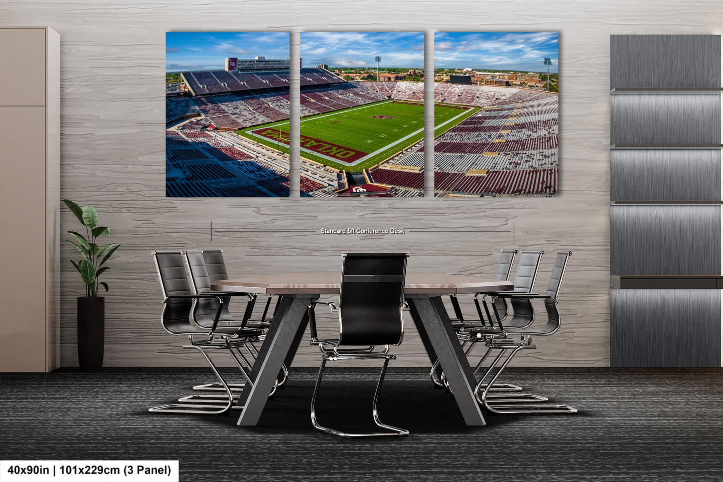 a dining room table with chairs and a wall mounted picture of a soccer field