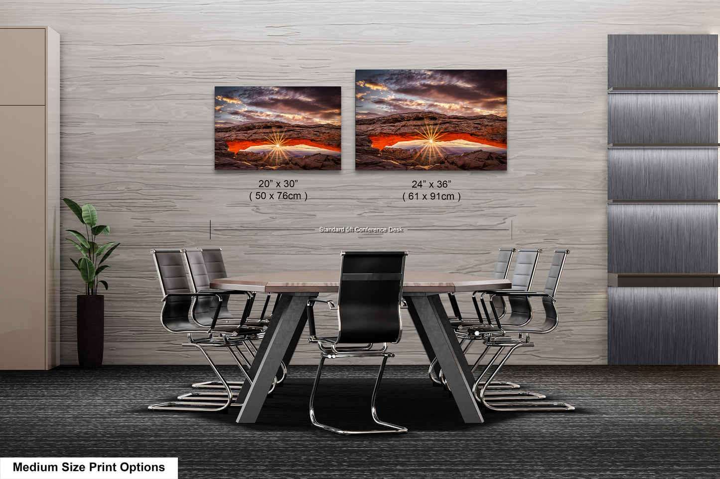 a dining room table with four chairs and two pictures on the wall