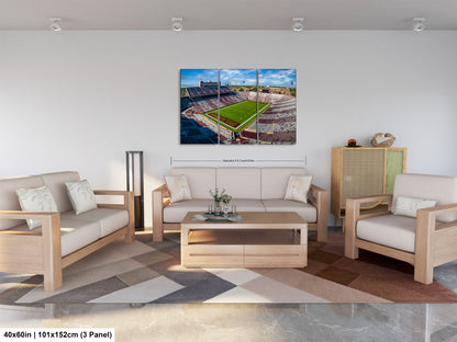 a living room filled with furniture and a painting on the wall