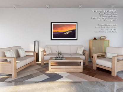 a living room filled with furniture and a painting on the wall