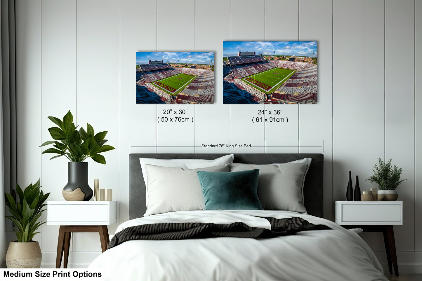 a bedroom with a bed and two pictures of a stadium