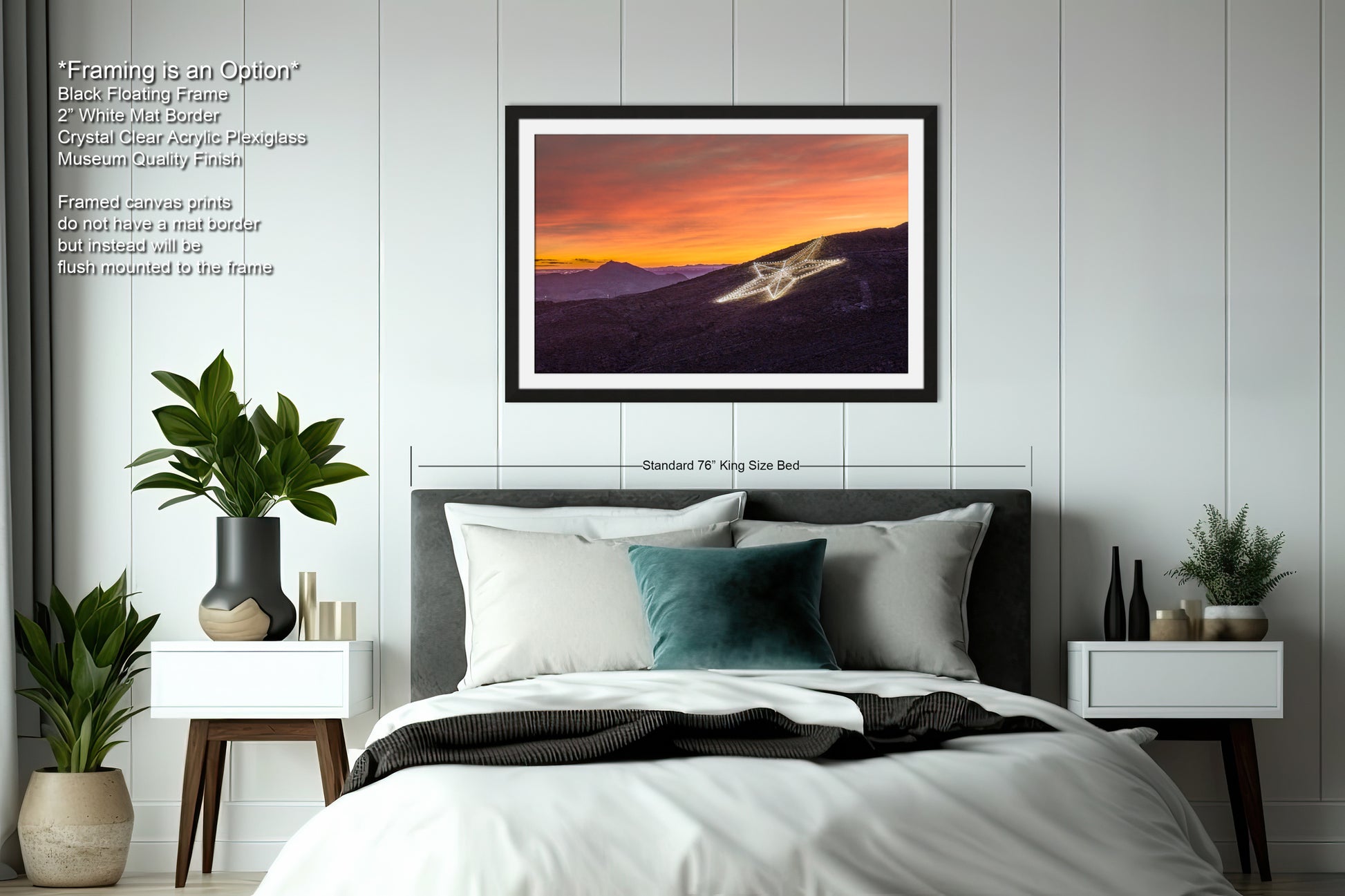 a bedroom with a bed and a picture hanging on the wall