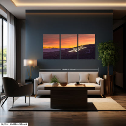 a living room filled with furniture and a painting on the wall