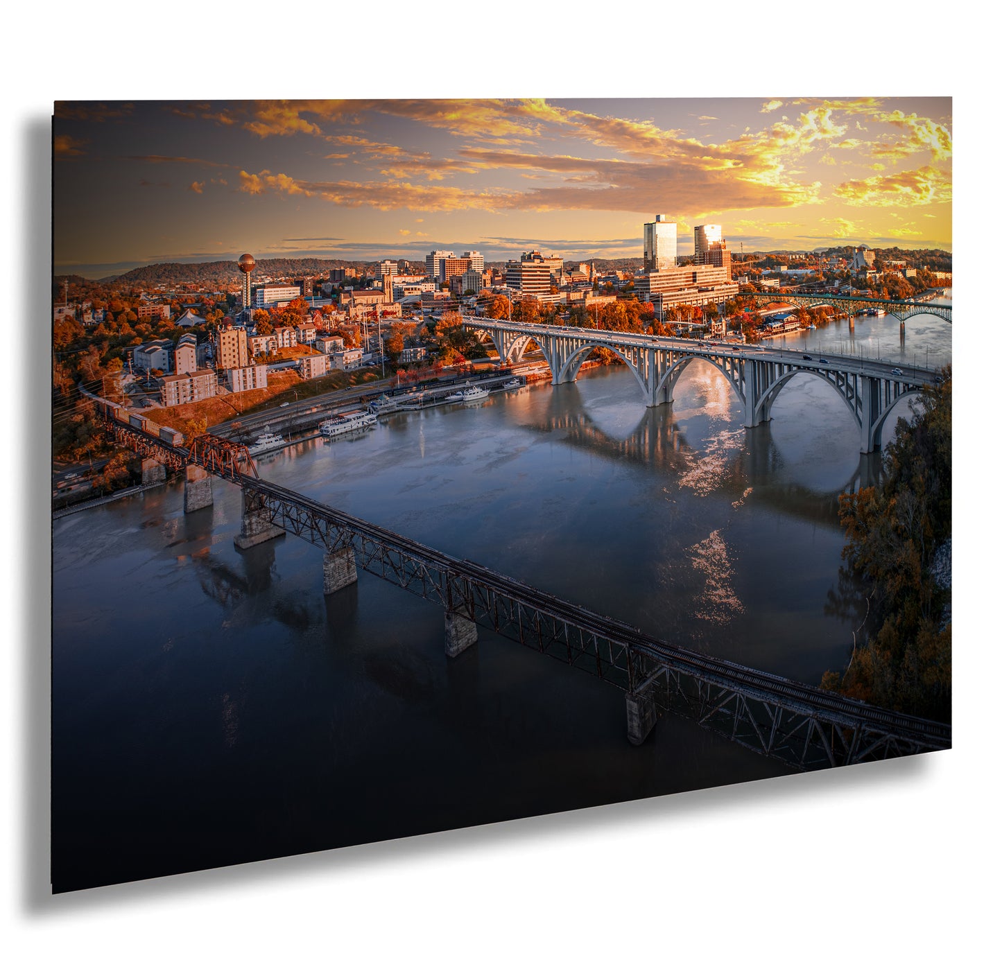 an aerial view of a city and a bridge