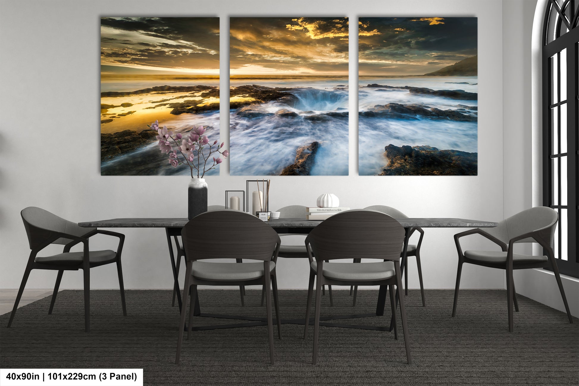 a dining room table with chairs and a painting on the wall
