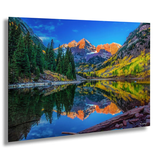 a mountain lake surrounded by trees and mountains