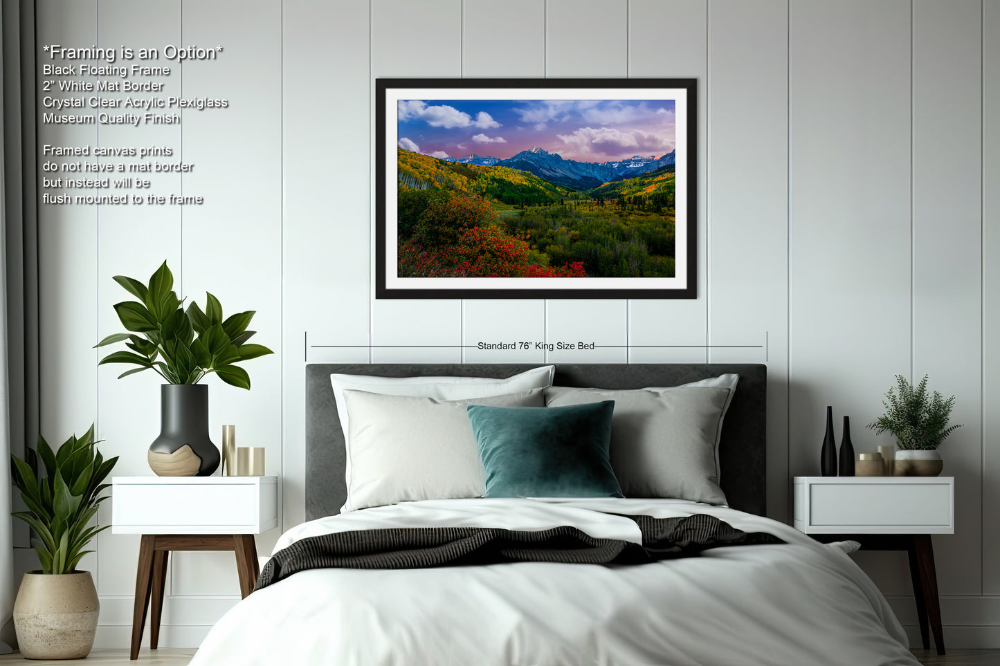 a bedroom with a large bed and a picture on the wall