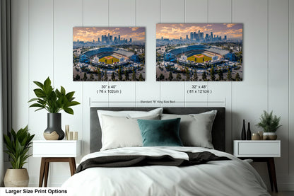 a bedroom with a large bed and two pictures on the wall