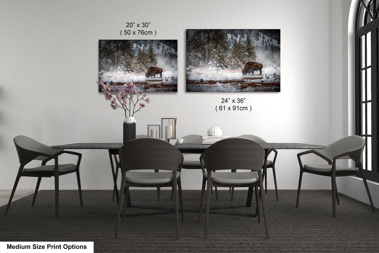 a dining room table with four chairs and a vase of flowers