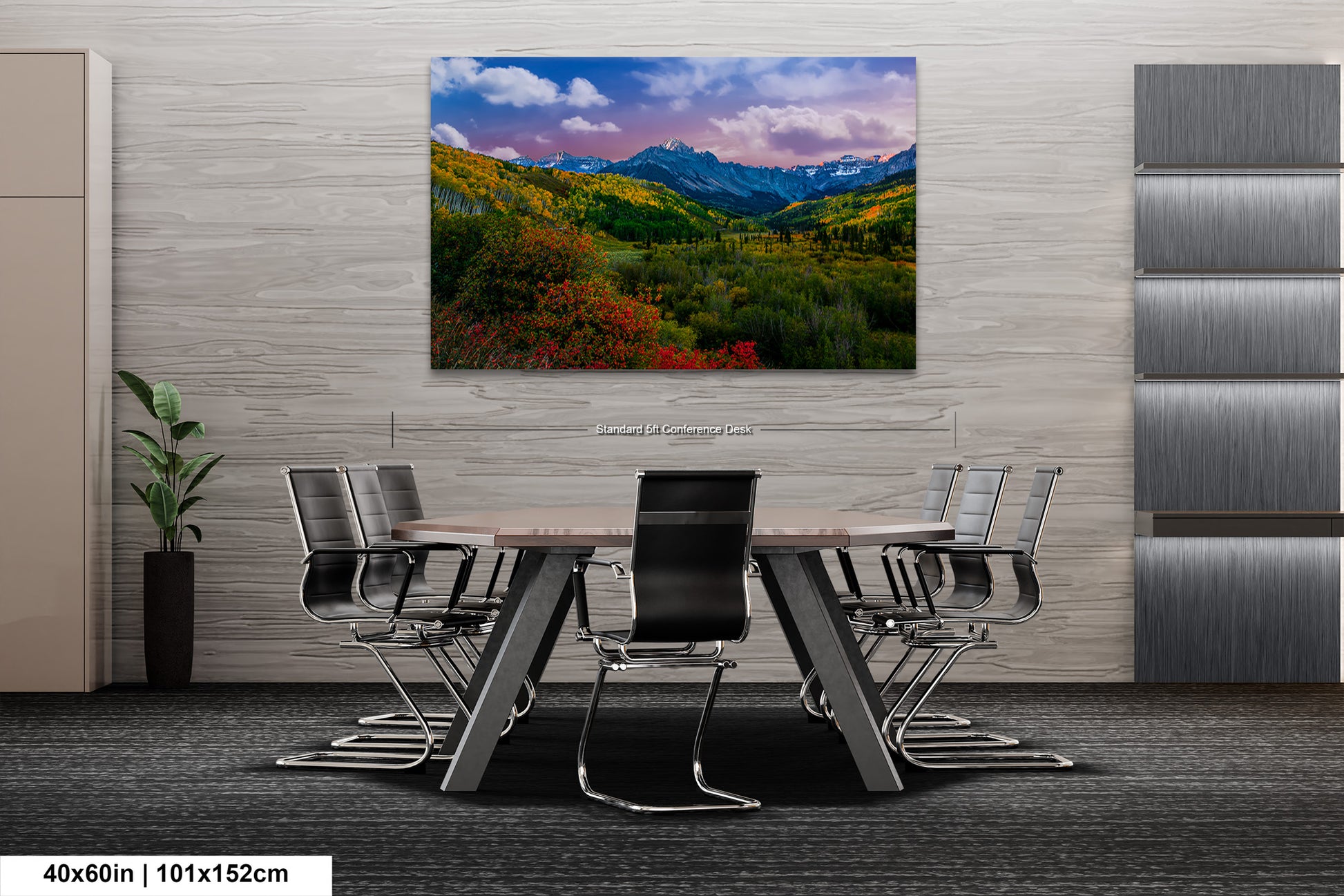 a dining room table with chairs and a painting on the wall