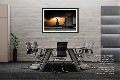 a dining room table with chairs and a picture hanging on the wall