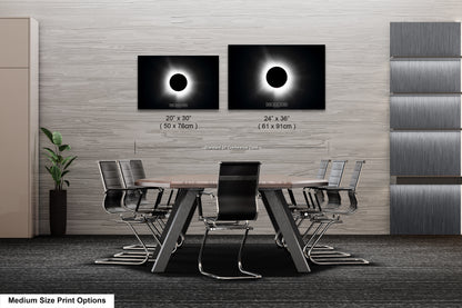 a dining room table with chairs and a picture of the solar eclipse