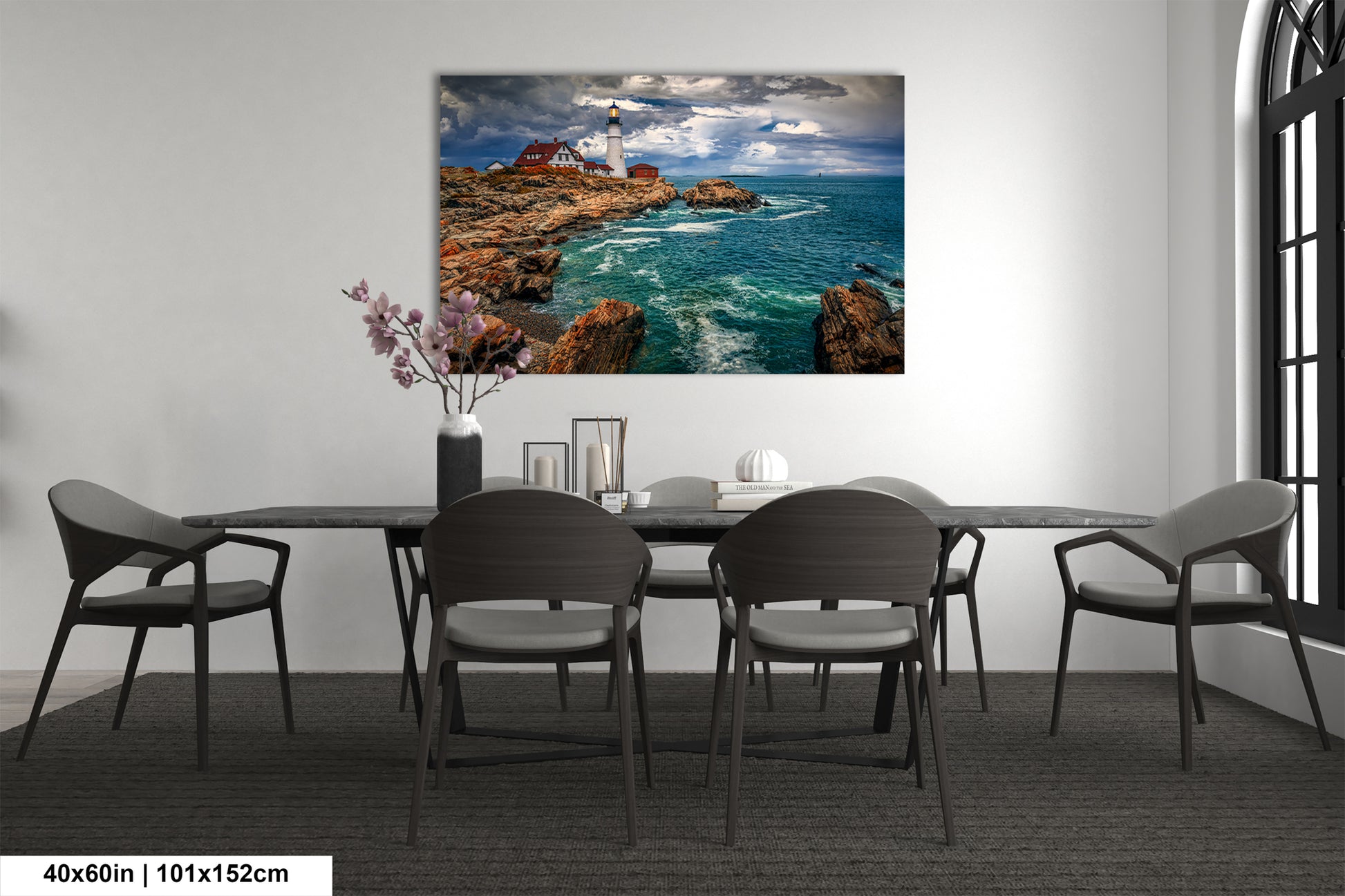 a dining room table with chairs and a painting on the wall