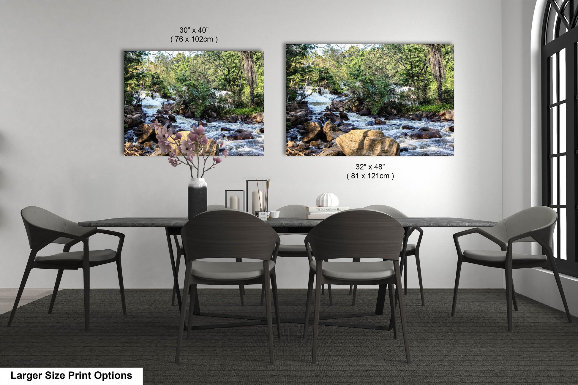 a dining room table with four chairs and two pictures on the wall