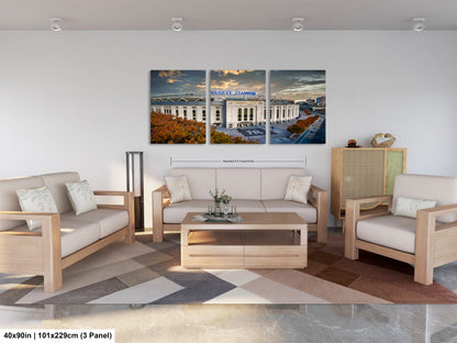 a living room filled with furniture and a painting on the wall