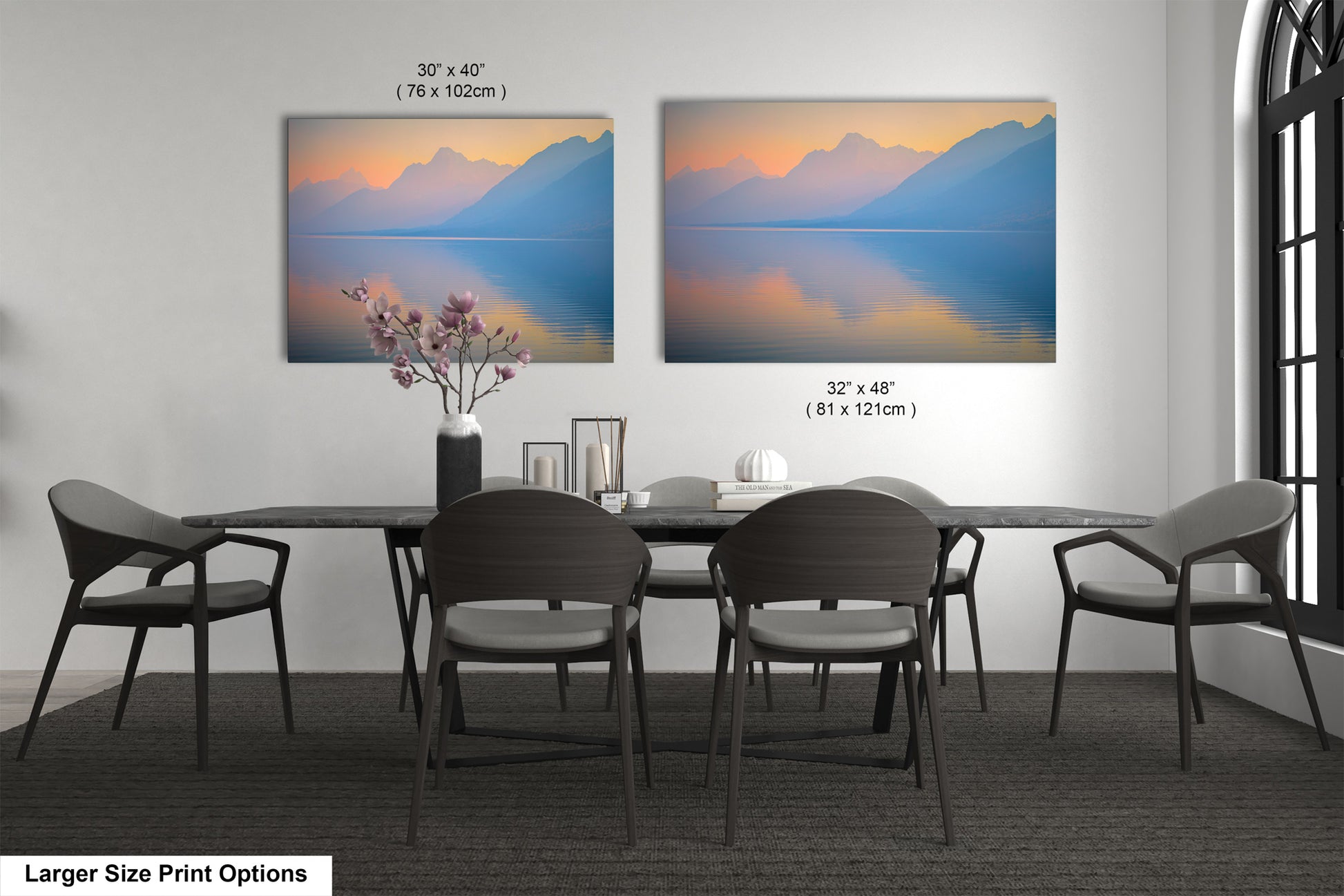 a dining table with four chairs and a vase of flowers