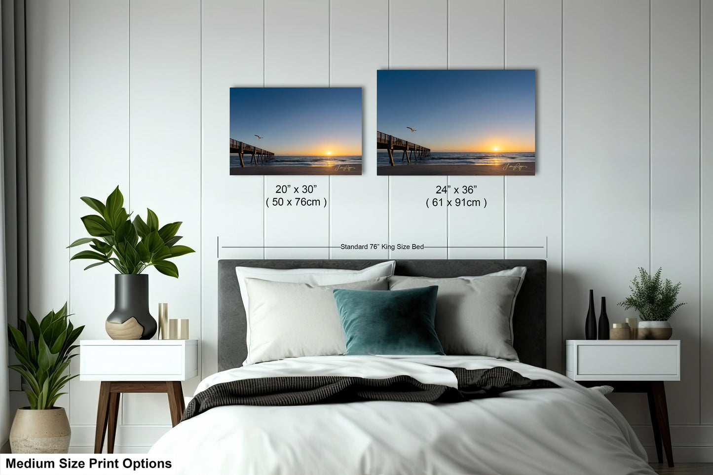 a bedroom with a bed and two pictures on the wall