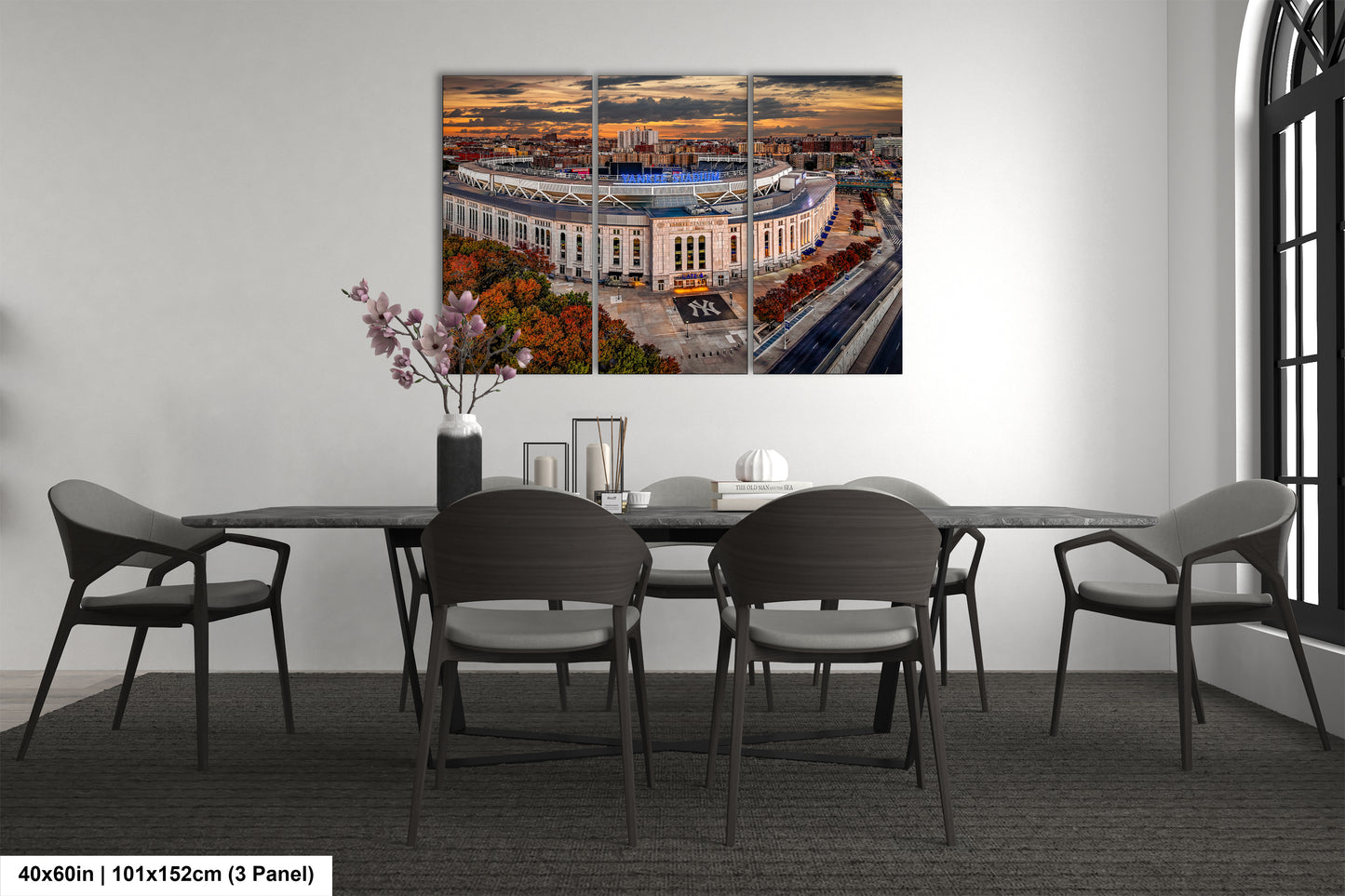 a dining room table with a view of a baseball stadium