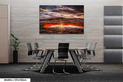 a dining room table with chairs and a painting on the wall