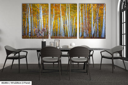 a dining room table with four chairs and a painting on the wall