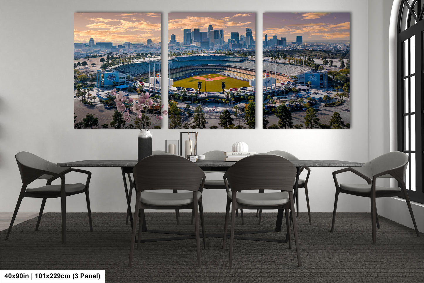 a dining room table with four chairs and a view of a baseball stadium