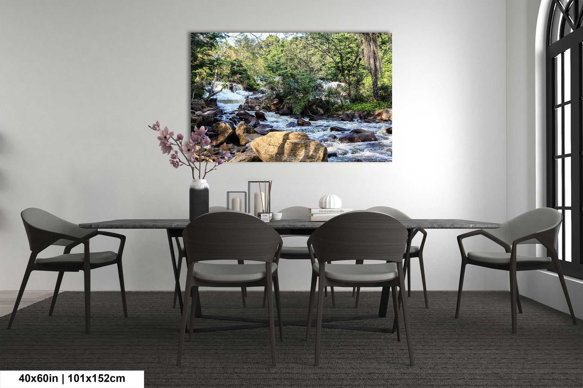 a dining room table with chairs and a painting on the wall