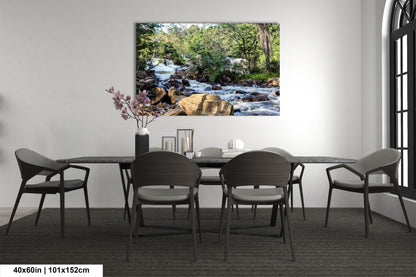 a dining room table with chairs and a painting on the wall