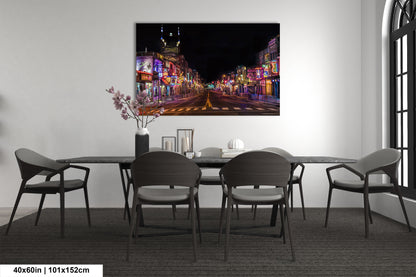 a painting of a city street at night