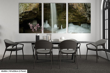 a dining room table with four chairs and a waterfall in the background