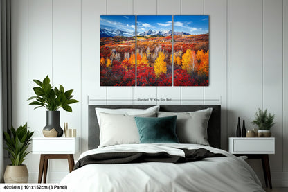a bedroom with a bed and a painting on the wall