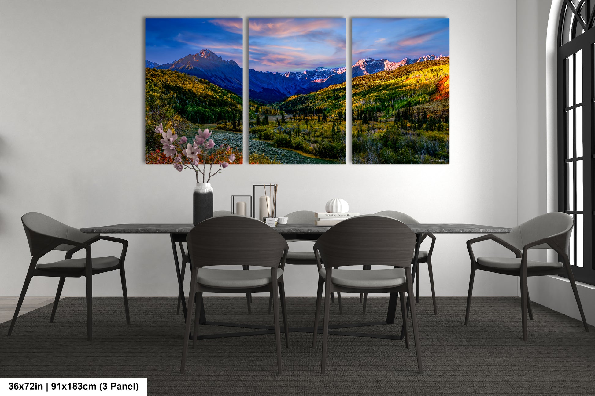 a dining room with a table and four chairs