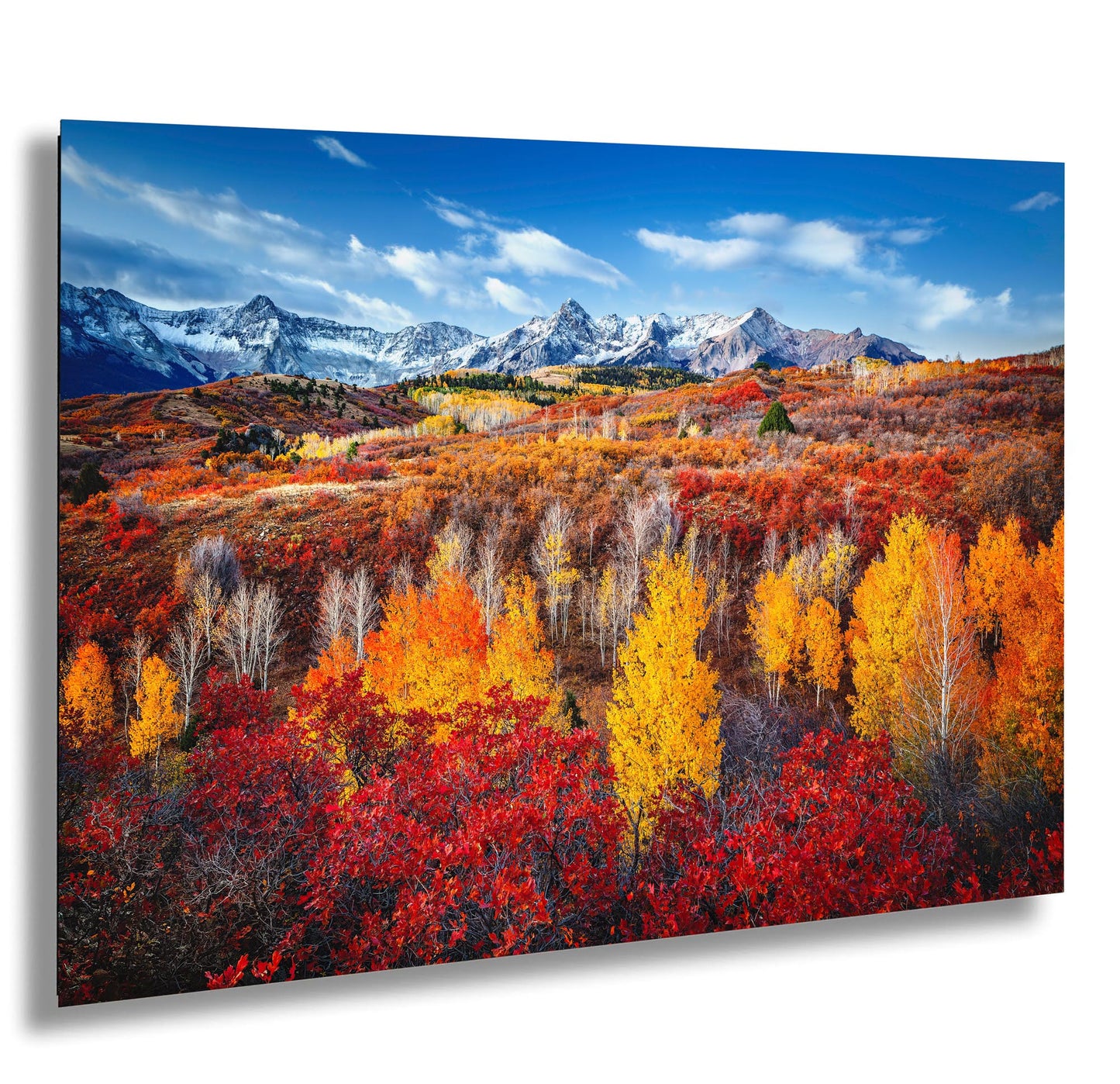 a scenic view of a mountain range in autumn