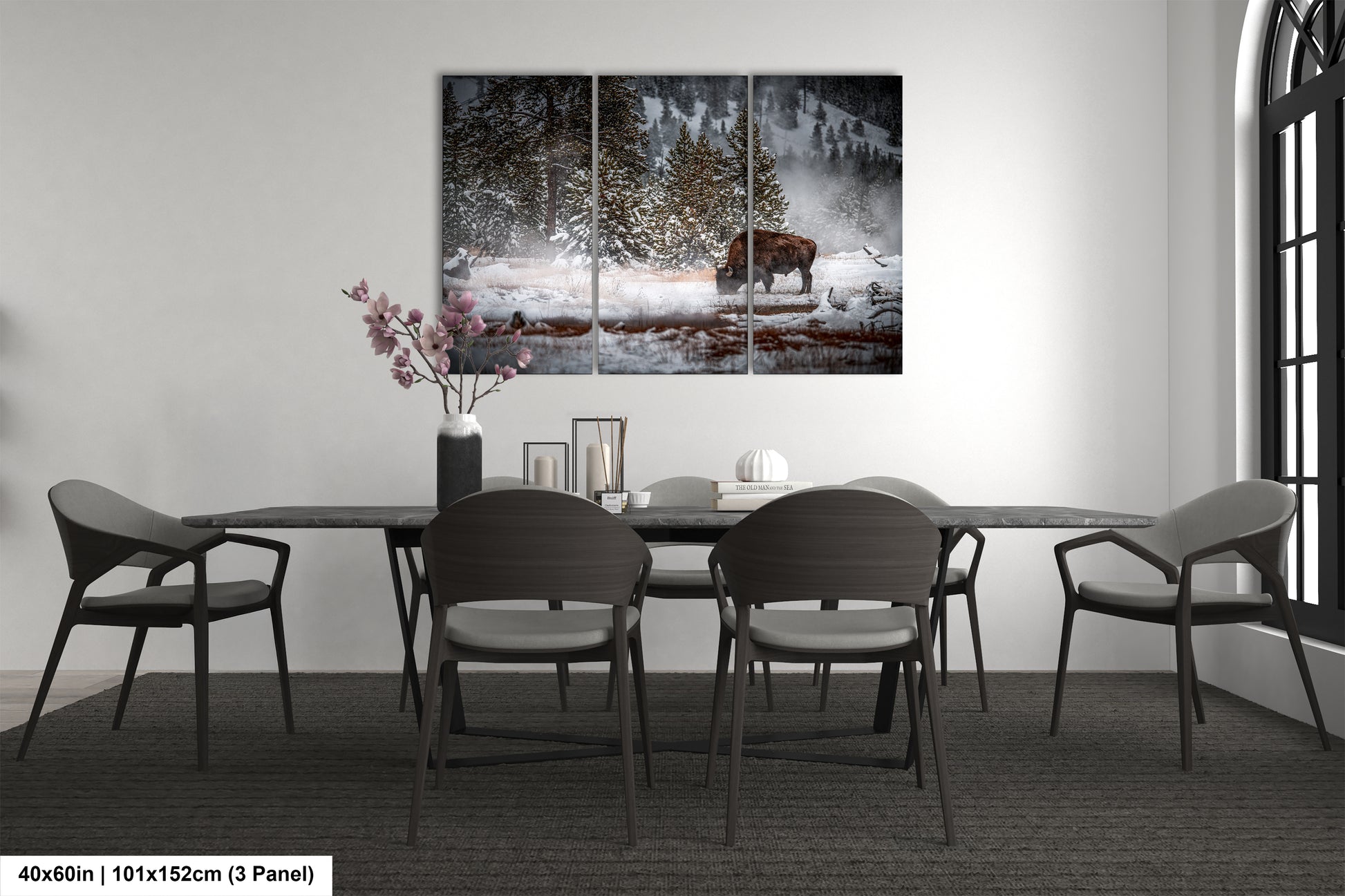 a dining room table with chairs and a painting on the wall