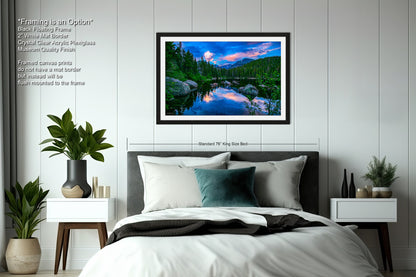 a bedroom with a large bed and a painting on the wall