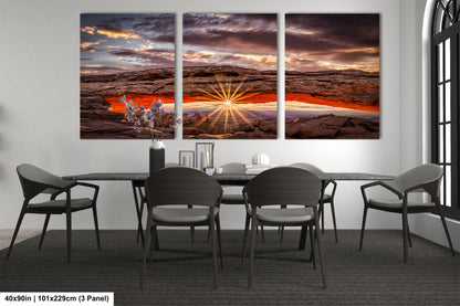 a dining room table with chairs and a painting on the wall