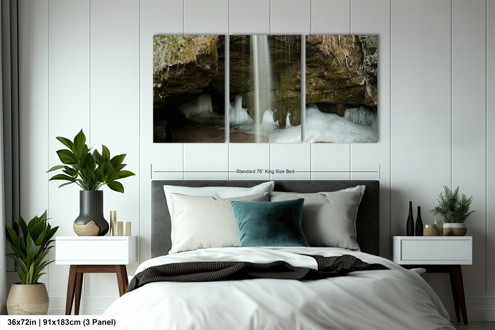 a bed with a white comforter and two paintings on the wall