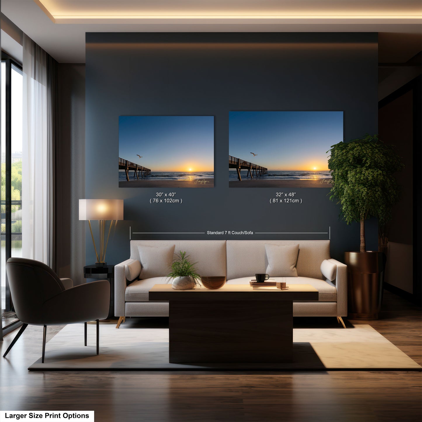a living room with a couch and two pictures on the wall